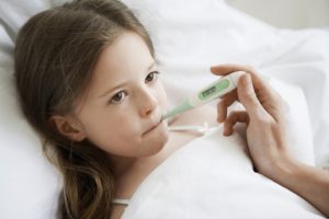 Girl With Thermometer In Mouth